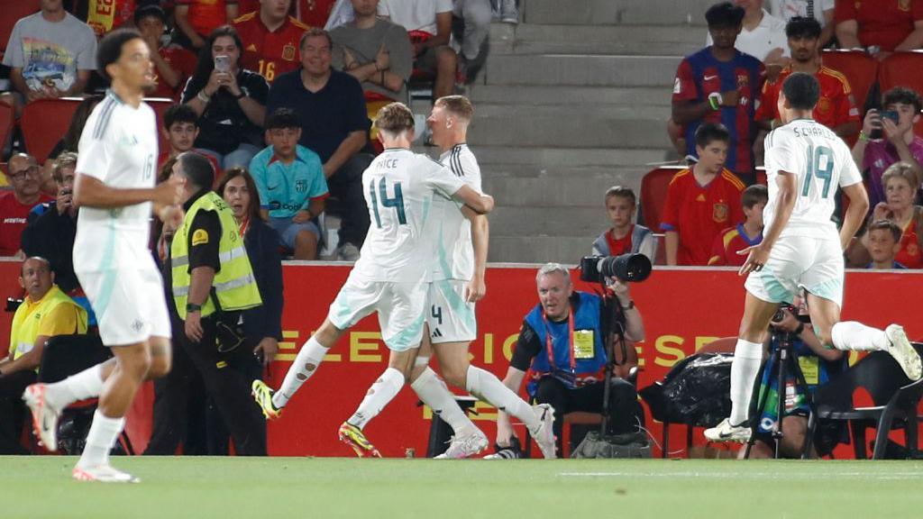 Dan Ballard celebrates against Spain