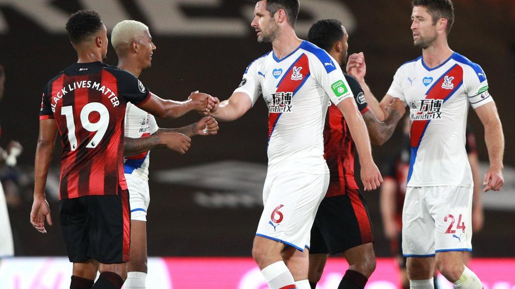 Crystal Palace and Bournemouth's players shake hands at the end