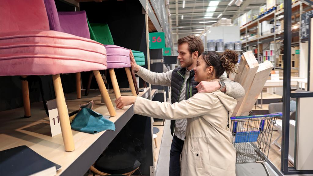 A young couple shop for furniture