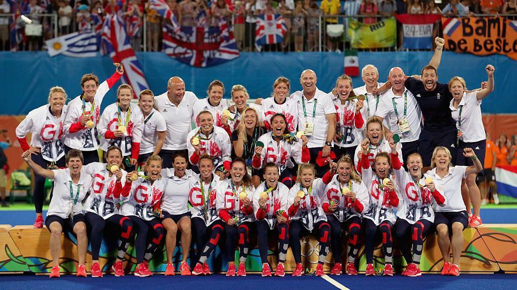 Team GB hockey players and staff on the podium at Rio 2016