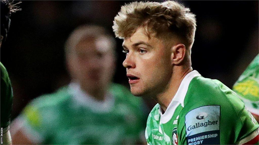 Charlie Atkinson runs with the ball while playing for Leicester Tigers