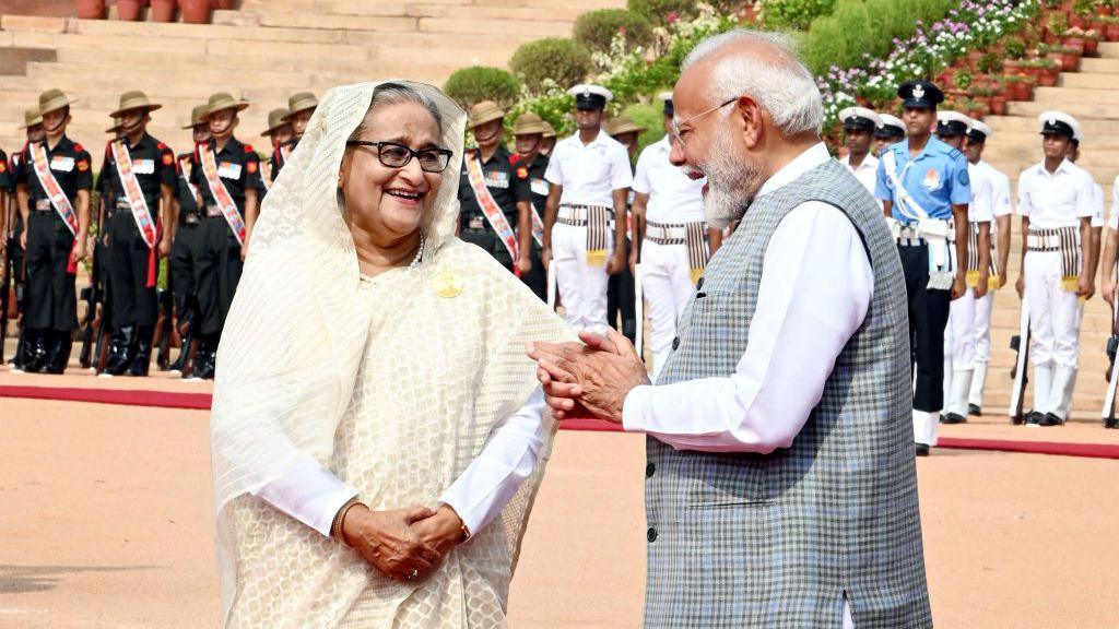 NEW DELHI, INDIA - JUNE 22: Prime Minister Narendra Modi, right, talks with his Bangladeshi counterpart Sheikh Hasina during latter's ceremonial reception at the Rashtrapati Bhawan on June 22, 2024 in New Delhi, India. Prime Minister Narendra Modi and Bangladesh Prime Minister Sheikh Hasina on Saturday discussed furthering defense ties, defense production, cooperation on counter-terrorism, management of the border and other issues, in their bilateral talks in New Delhi. PM Narendra Modi further said the two countries are focusing on connectivity, commerce and collaboration. He said the two nations will enhance focus on digital and energy connectivity to spur their economies. (Photo by Arvind Yadav/Hindustan Times via Getty Images)