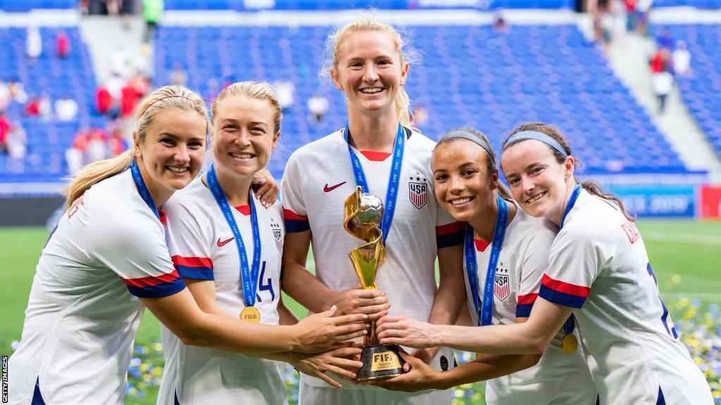 USA players celebrate with the Women's World Cup trophy