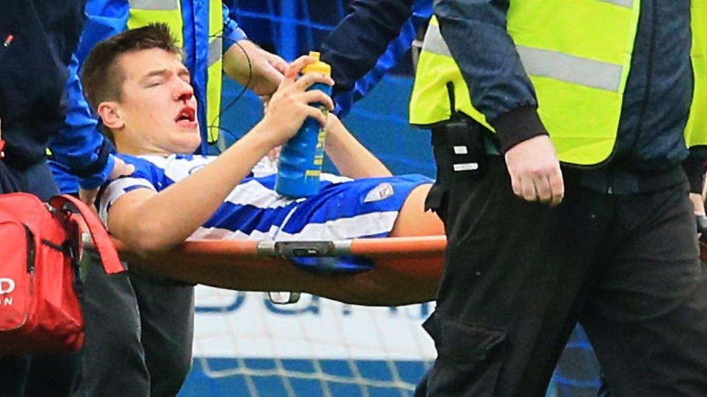 Brad Lyons is stretchered off after sustaining his injuries in the league win over Linfield