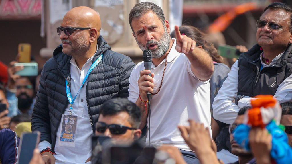 VARANASI, INDIA - FEBRUARY 17: India's Congress Party leader Rahul Gandhi (sitting atop a vehicle, wearing white) takes part in a roadshow as part of his 'Bharat Jodo Nyay Yatra' (India Come Together Anew Tour) on February 17, 2024 in Varanasi, India