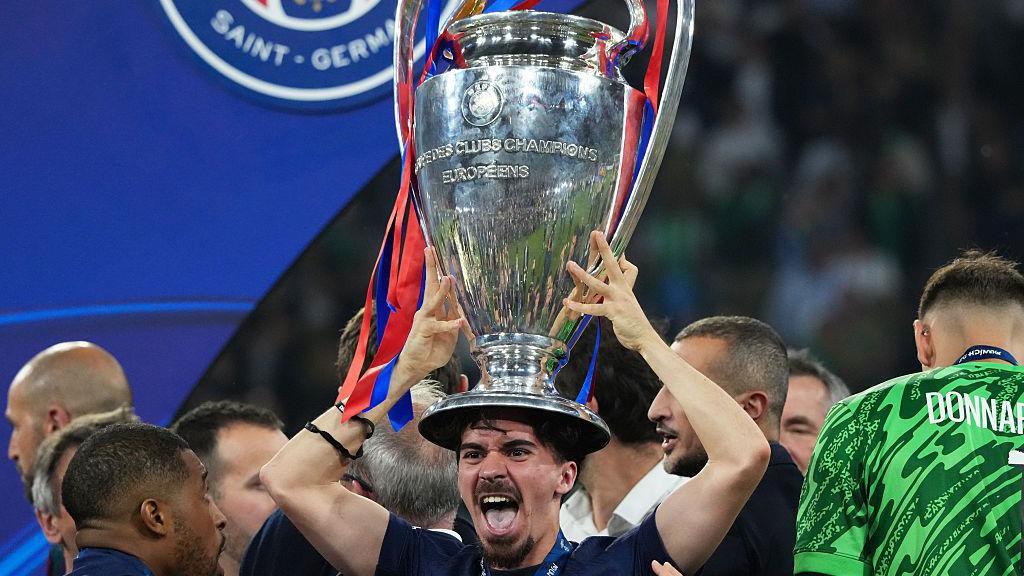 Vitinha with the Champions league trophy