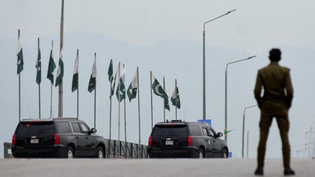 A convoy heads through Islamabad, as delegations from the United States and Iran are expected to hold peace talk