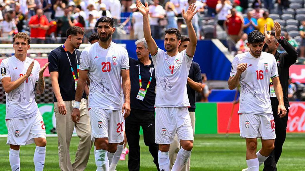 Iran players applaud their fans at the Los Angeles Stadium