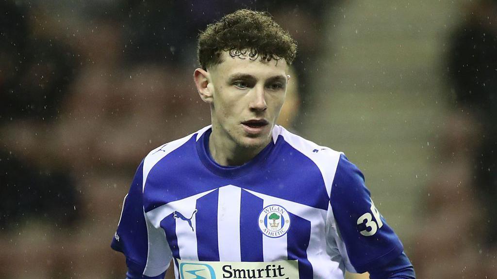 Harrison Bettoni looking concentrated while playing for Wigan