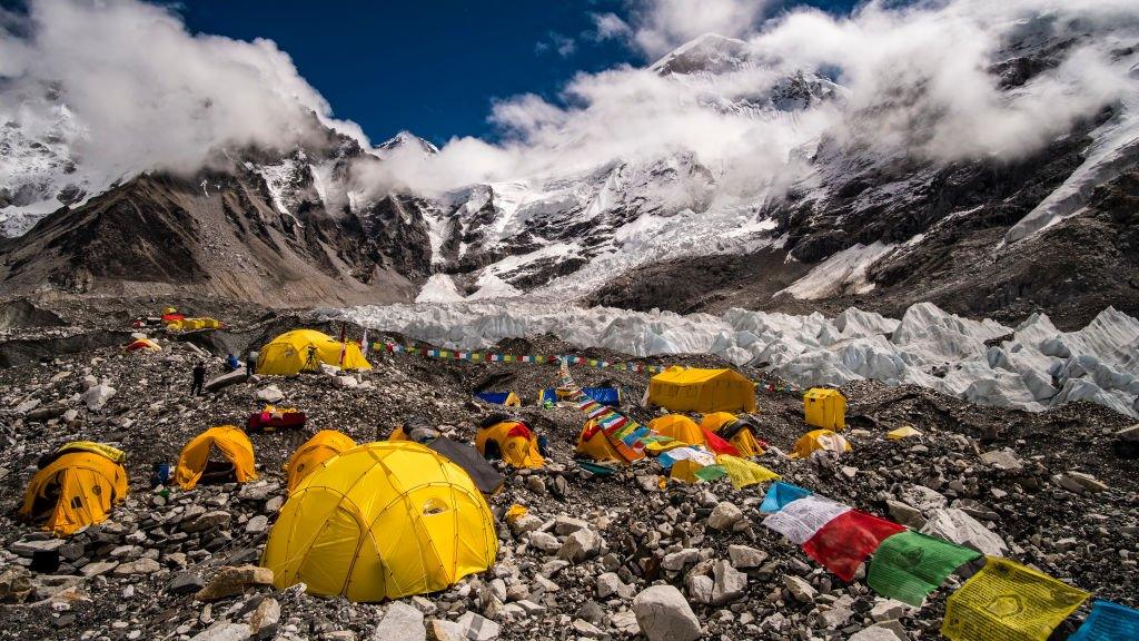 GORAKSHEP, SOLU KHUMBU, NEPAL - 2019/09/15: Tents set up at Everest Base Camp on Khumbu glacier, Mt. Everest behind covered by monsoon clouds. (Photo by Frank Bienewald/LightRocket via Getty Images)