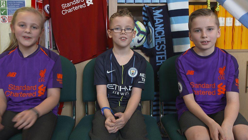 Three football fans in their team kits