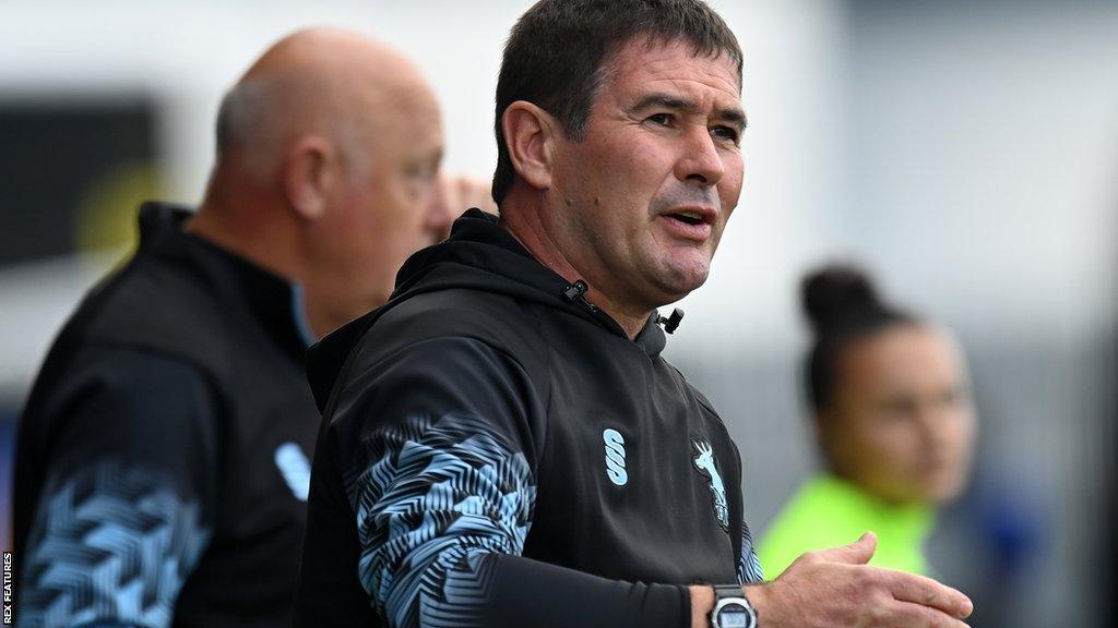 Mansfield boss Nigel Clough on the sidelines directing his player