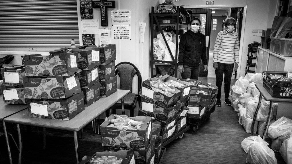 Volunteers at West End Food Bank preparing food supplies