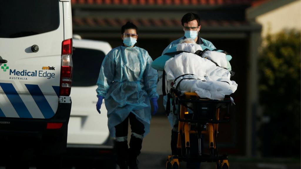 A patient is removed from an aged care facility experiencing an outbreak of the coronavirus disease (COVID-19) in Melbourne, Australia, July 31, 2020