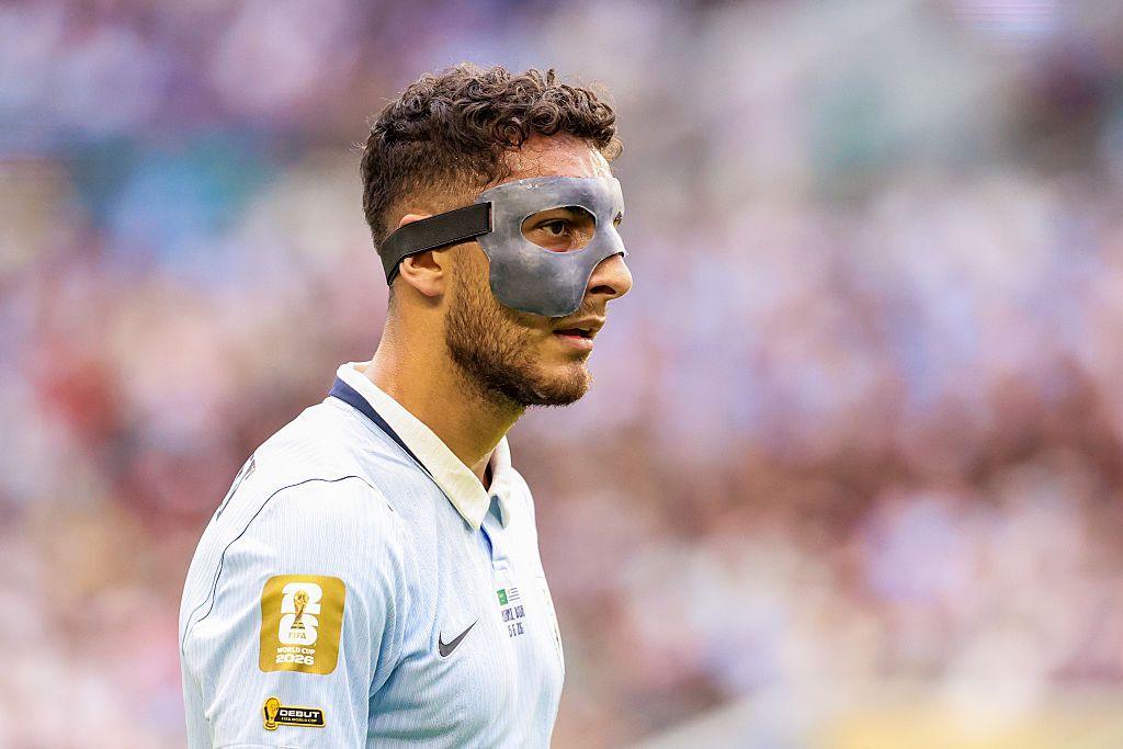 Sebastián Cáceres playing for Uruguay is seen wearing a protective face mask.