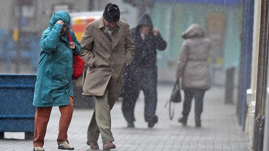 People walking in a storm