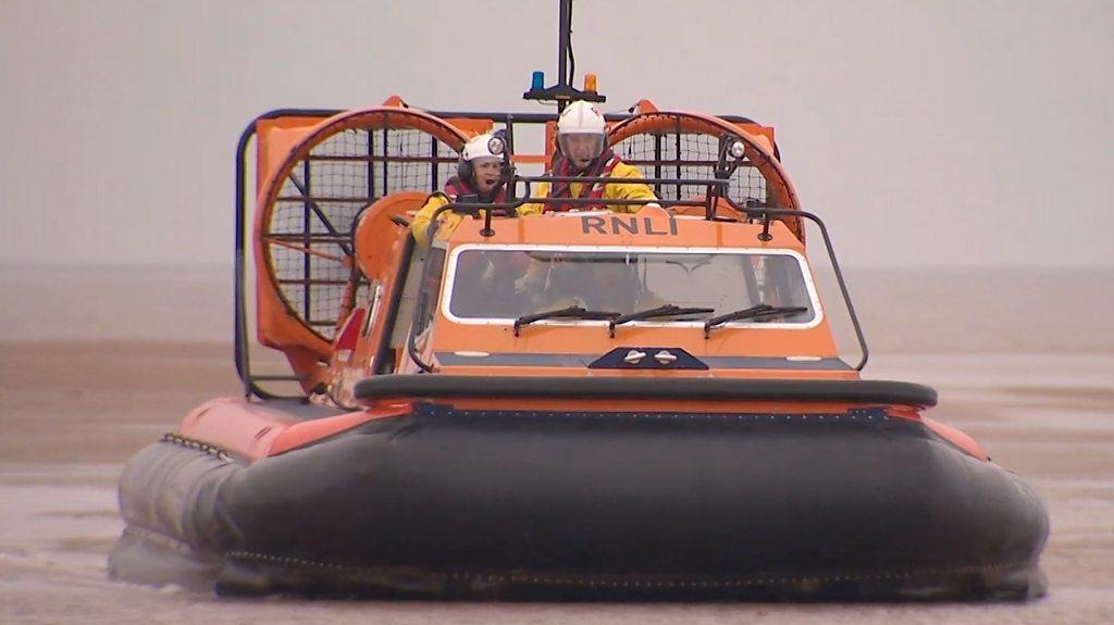 RNLI hovercraft commander Charlie Parfitt piloting her craft.