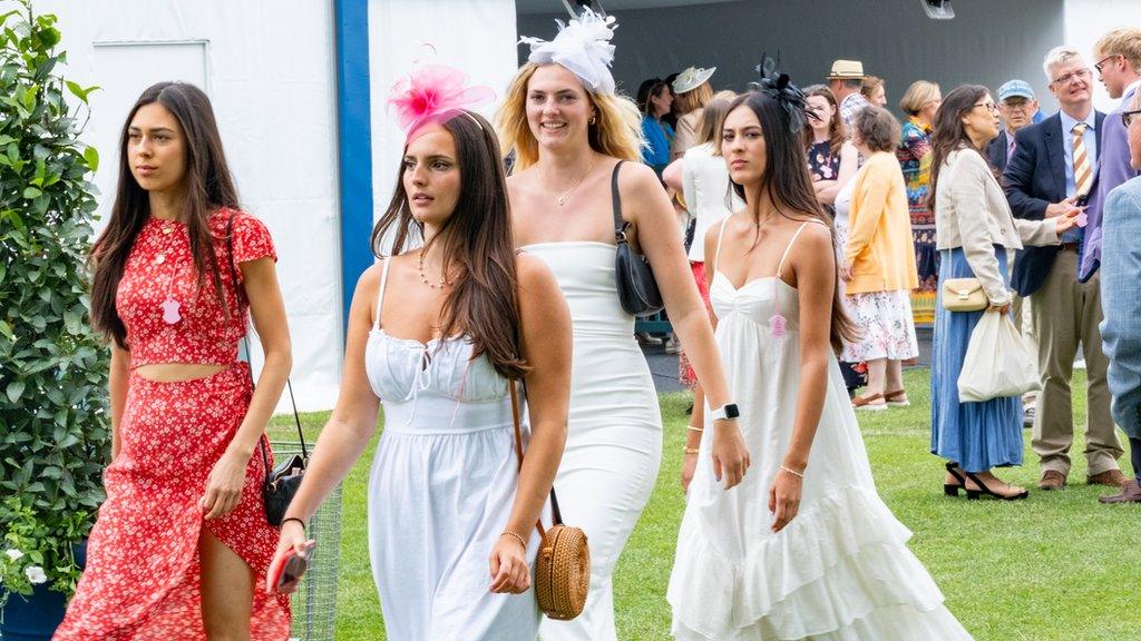 A group of women arriving at the regatta