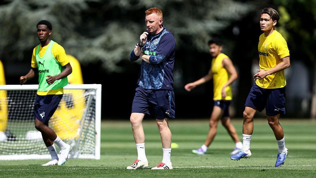 Will Still leads Southampton players in a coaching session