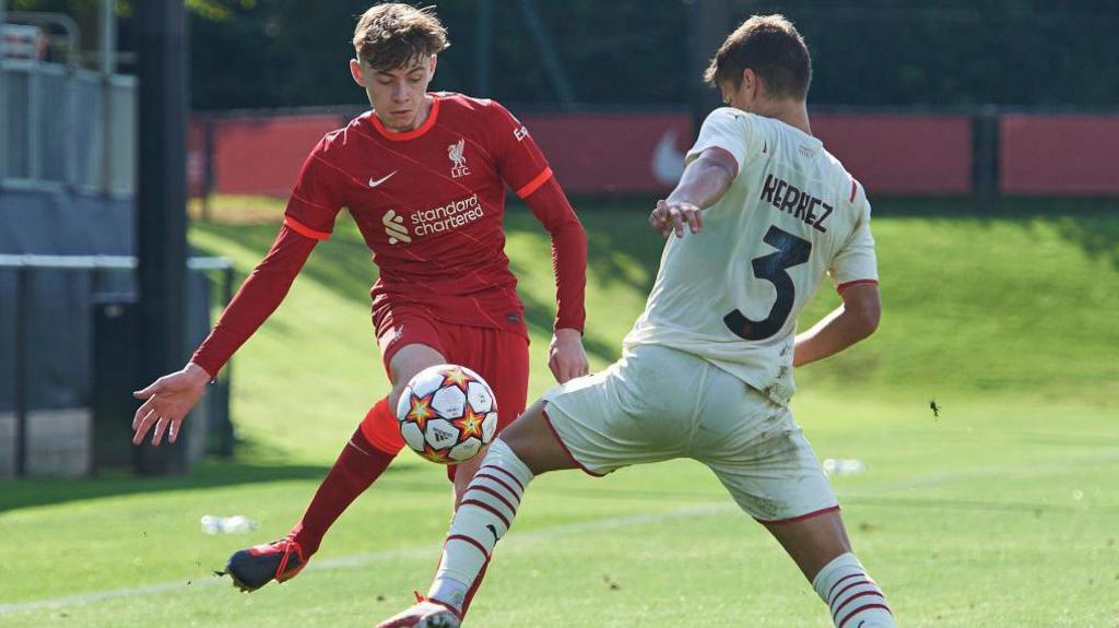 Milos Kerkez battles for the ball with Liverpool's Conor Bradley in a Uefa Youth League game