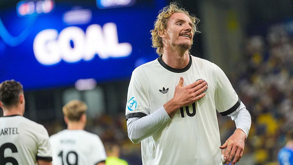 Stuttgart striker Nick Woltemade celebrates after scoring for Germany Under-21s.