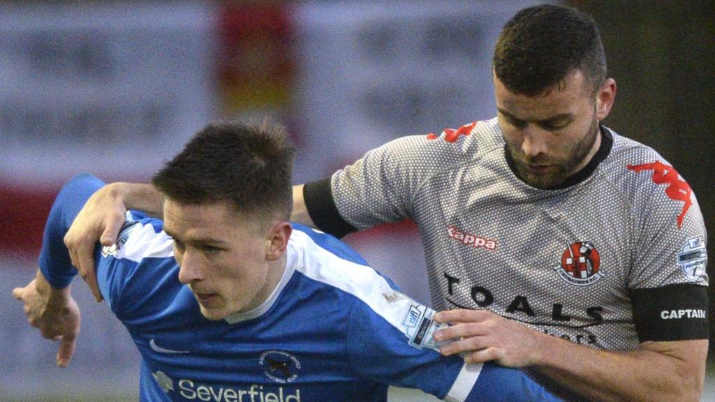 Action from Ballinamallard United against Crusaders