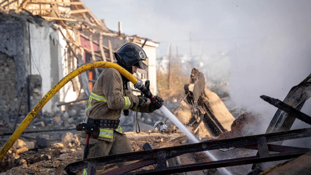 A firefighter works at the site of a residential area damaged by a Russian missile strike in Odesa