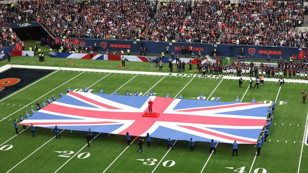 The United Kingdom flag on the Tottenham Hotspur Stadium pitch