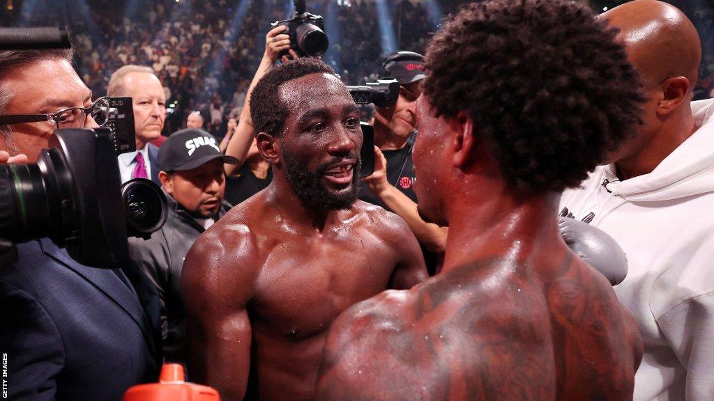 Terence Crawford speaks to Errol Spence in the ring after their fight