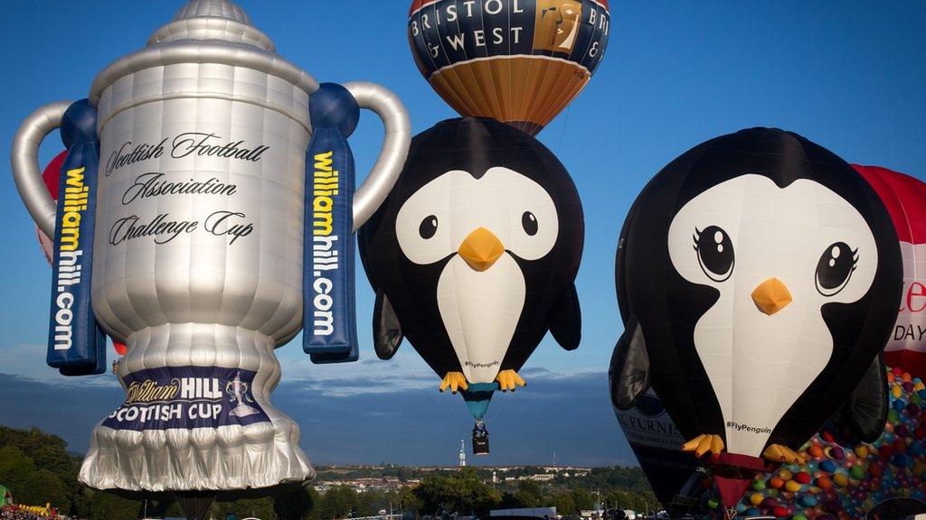 Balloons take to the skies on the first day of the Bristol International Balloon Fiesta at the Ashton Court estate on August 6, 2015 in Bristol, England. Now in its 37th year, the Bristol International Balloon Fiesta is Europe"s largest annual hot air balloon event in the city that is seen by many balloonists as the home of modern ballooning.