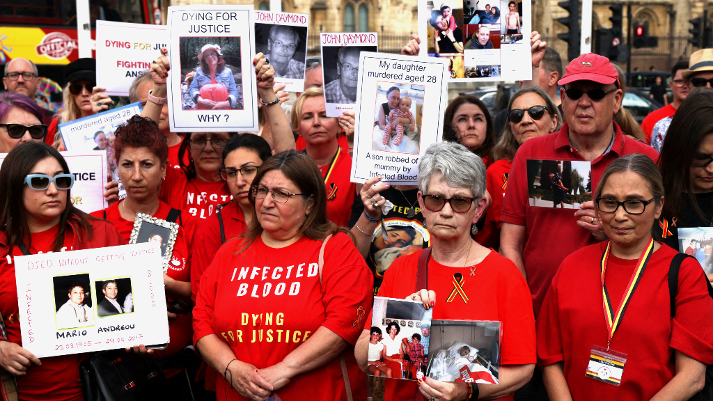 People impacted by the contaminated blood scandal gather in Westminster for a vigil to remember those that lost their lives, ahead of the release of the final report of the Infected Blood Inquiry on Monday, in London