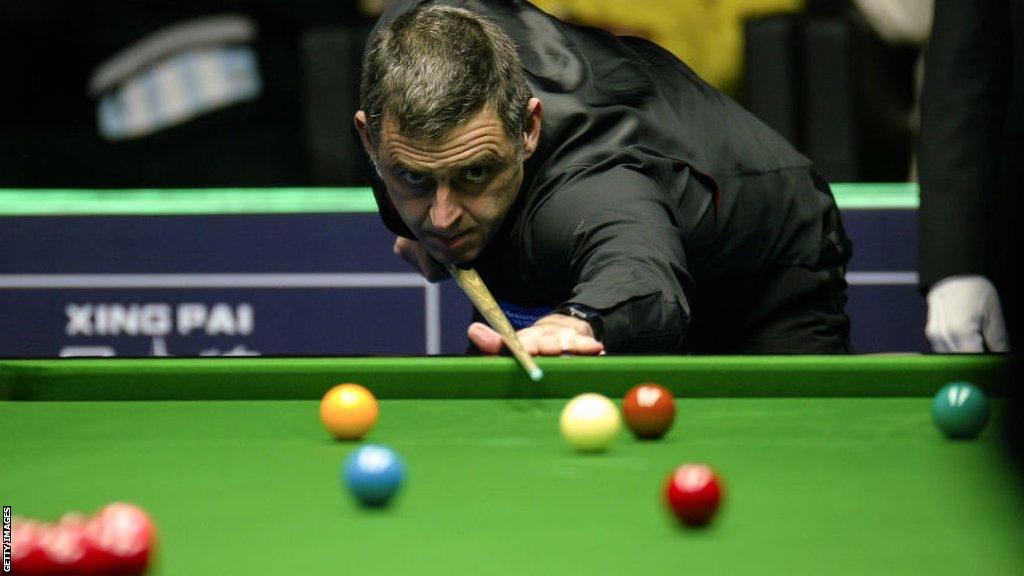 Ronnie O'Sullivan lines up a shot at the World Open in China