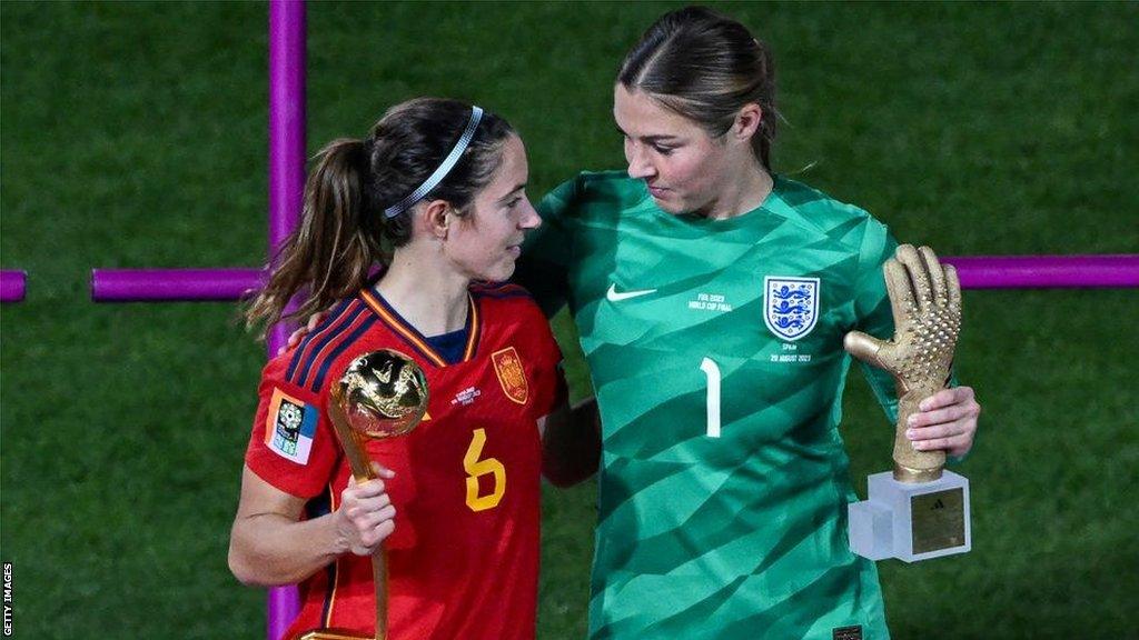 Spain's Aitana Bonmati with her Golden Ball trophy and England goalkeeper Mary Earps with her Golden Glove trophy