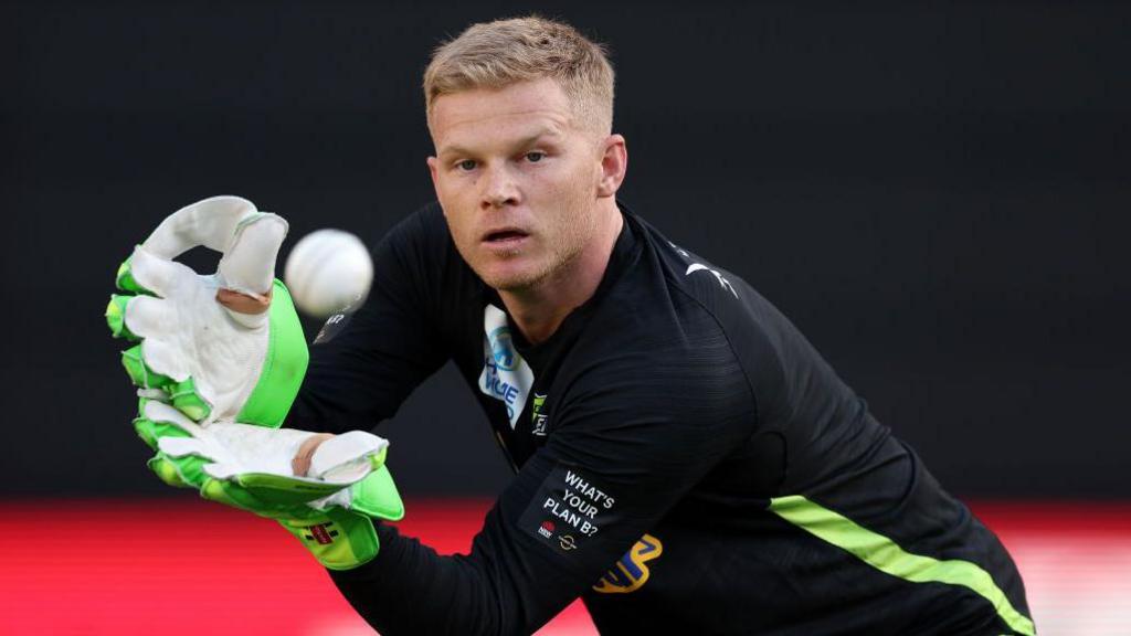 Sam Billings catches the ball