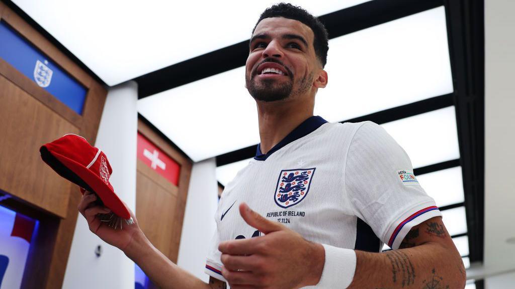 Dominic Solanke with an England cap