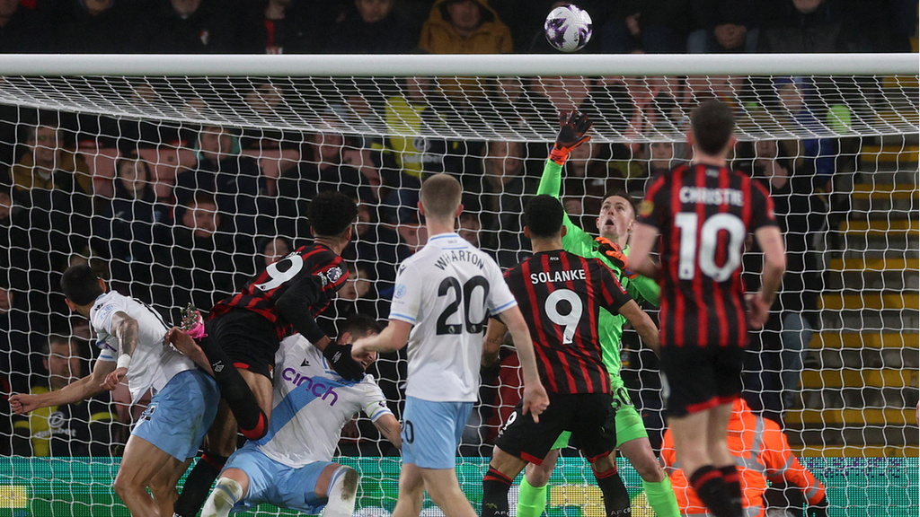 Philip Billing's header is tipped onto the bar by Dean Henderson