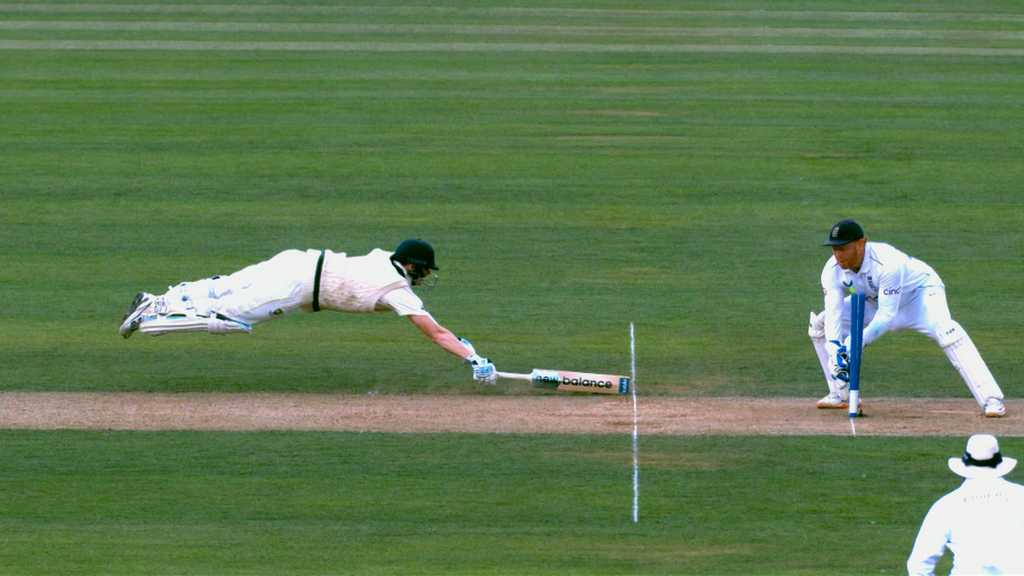 Steve Smith dives as he narrowly avoids being run out on 43