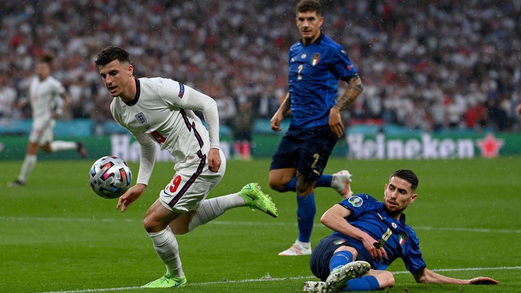 Mason Mount skips away from Italy's Jorginho during the Euro 2020 final at Wembley