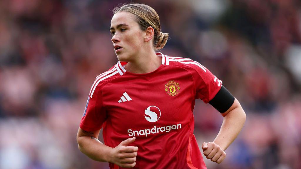 Grace Clinton playing for Manchester United