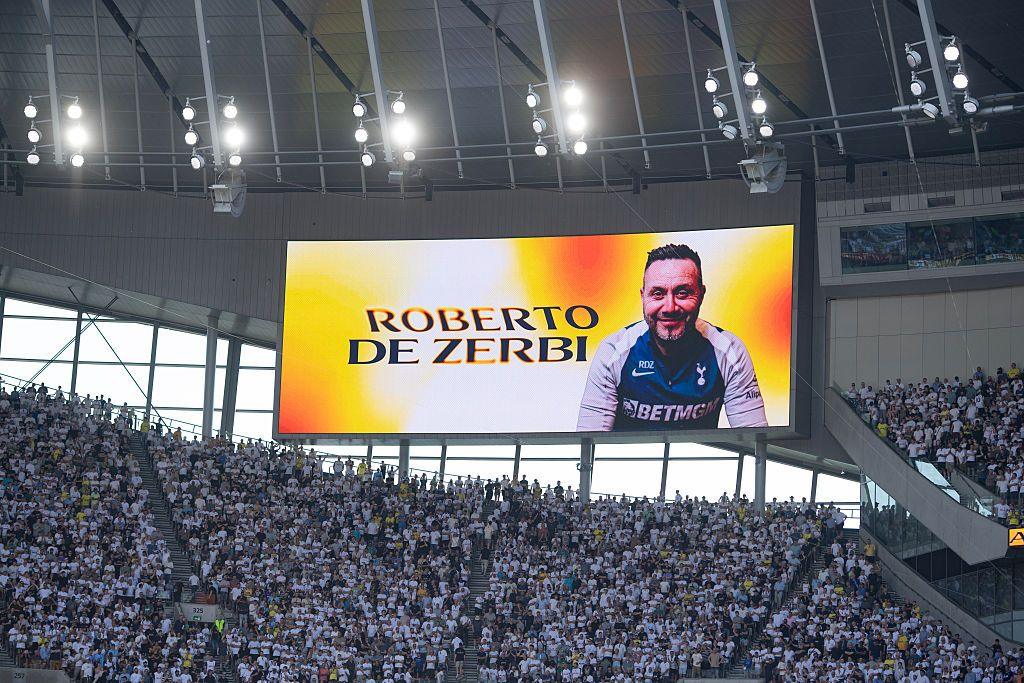Roberto De Zerbi's picture appears on screens inside Tottenham stadium