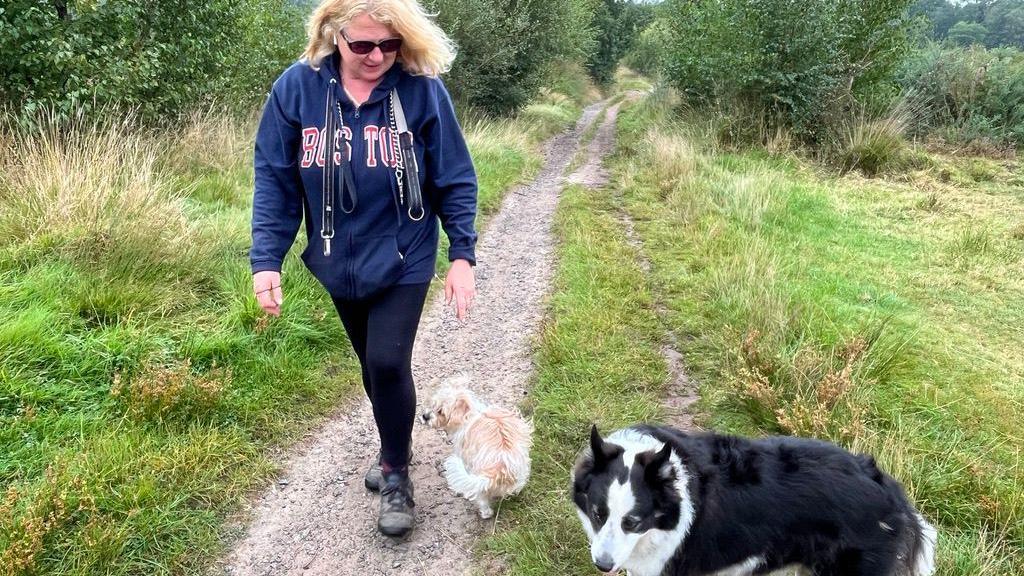 Sarah Bass walking her dogs Teddy and Luther