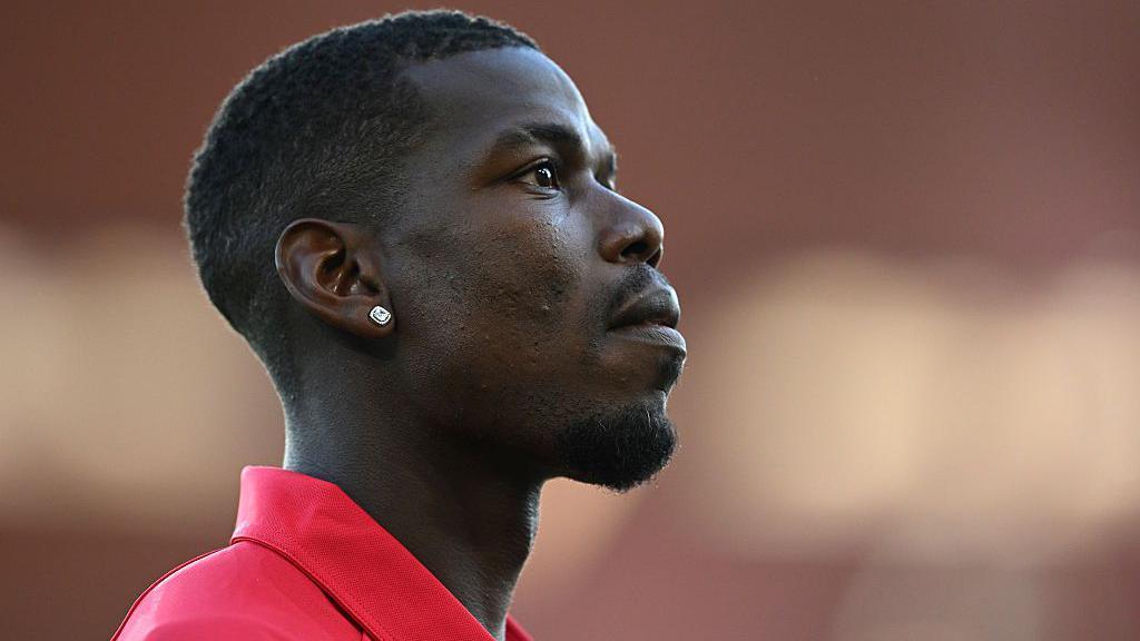 Paul Pogba looks on before kick-off of an AS Monaco match at Stade Louis II in Ligue 1