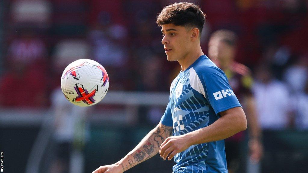 Alex Robertson in action for Manchester City