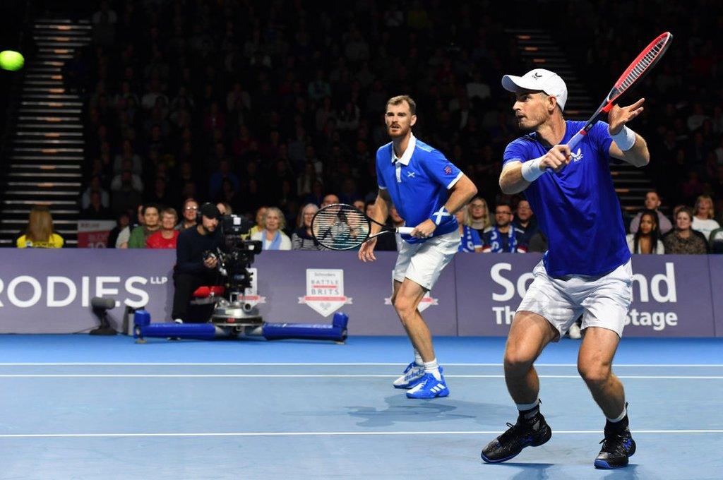 Andy and Jamie Murray playing tennis