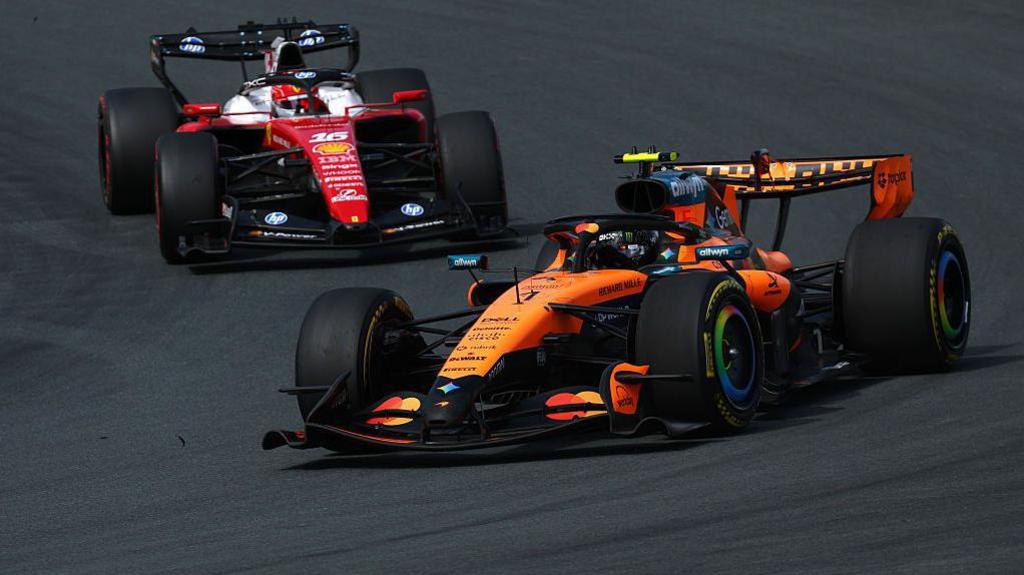 Lando Norris chased by Charles Leclerc during the Zandvoort sprint race 