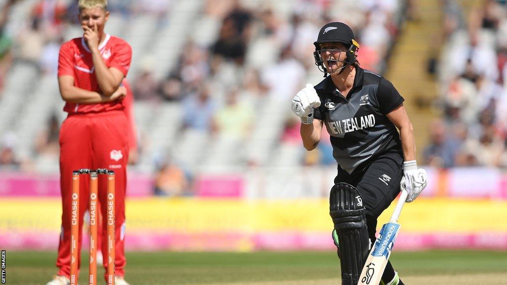 Sophie Devine of New Zealand (right) celebrates hitting the winning runs against England in the Commonwealth Games, as England bowler Issy Wong (left) watches on