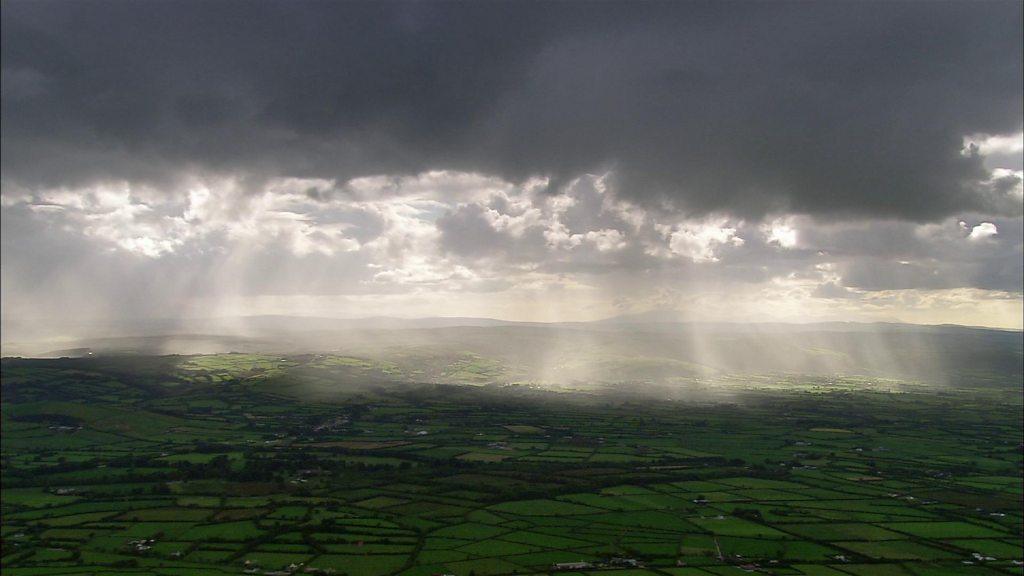 clouds over fields.