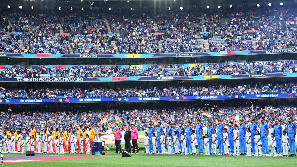 Zimbabwe's team lines up alongside India ahead of a game at 2022's ICC T20 World Cup in Australia