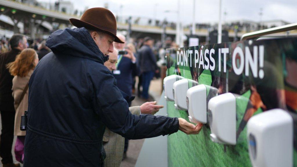 Man using hand sanitiser