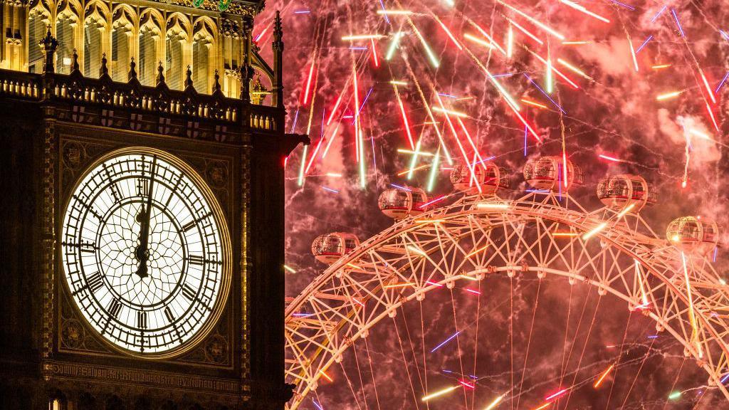 Fireworks light up the London skyline over Big Ben and the London Eye